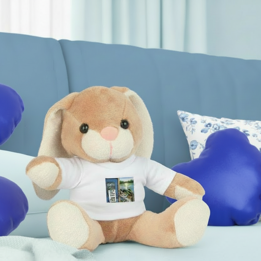 Plush bunny toy wearing a white shirt with a graphic on a blue couch.
