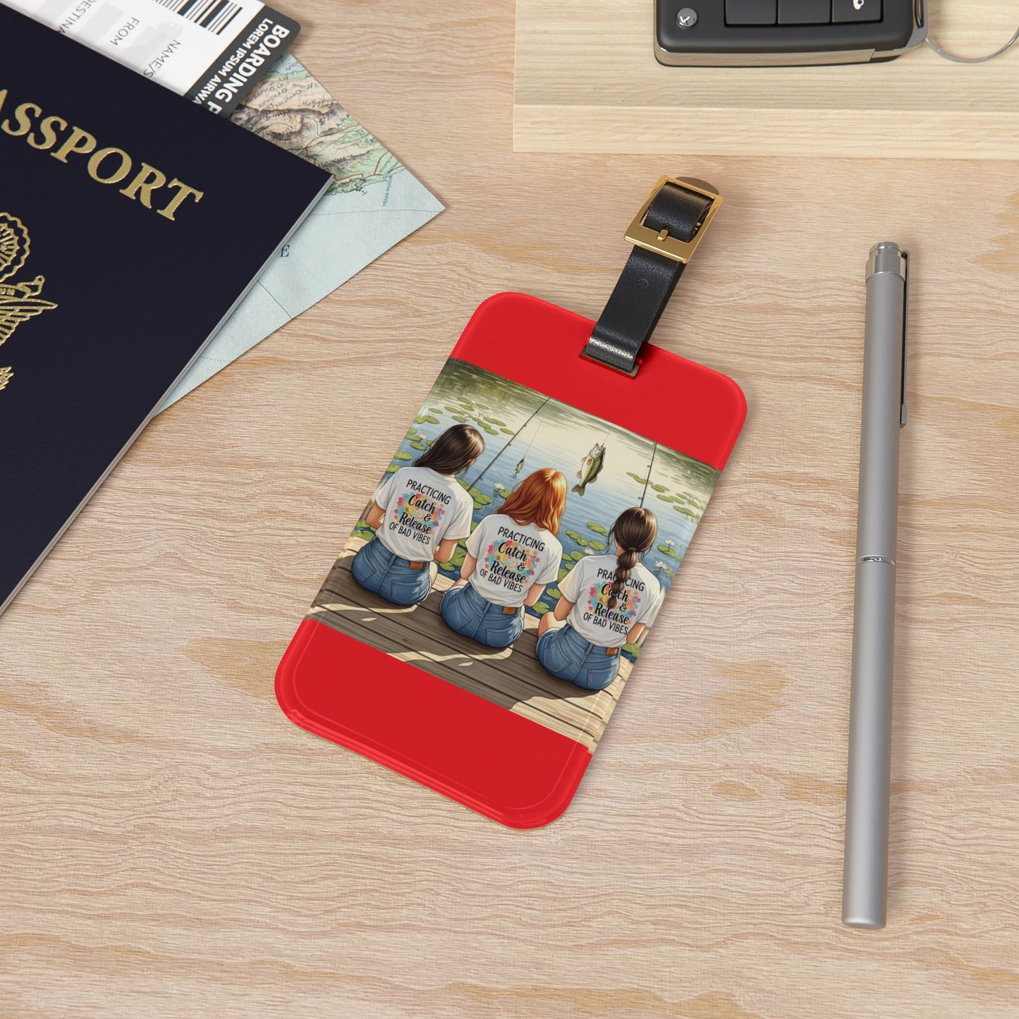 Luggage tag with a photo of three people on a wooden surface with a passport and pen.