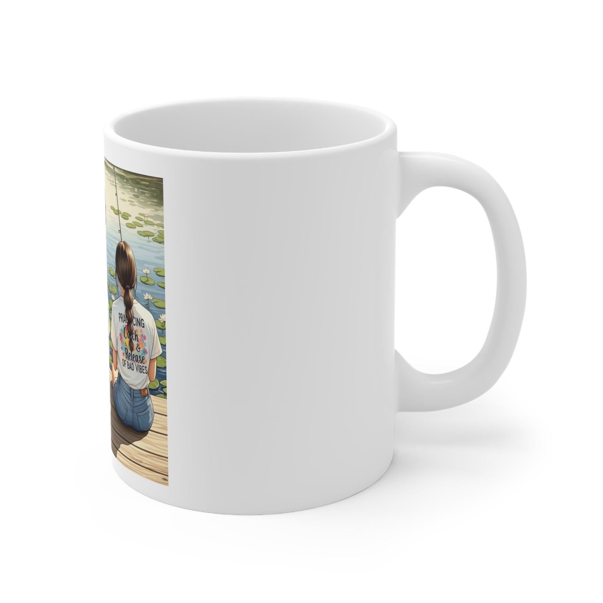 Side view of White mug with a photo of a person sitting by a lake on one side