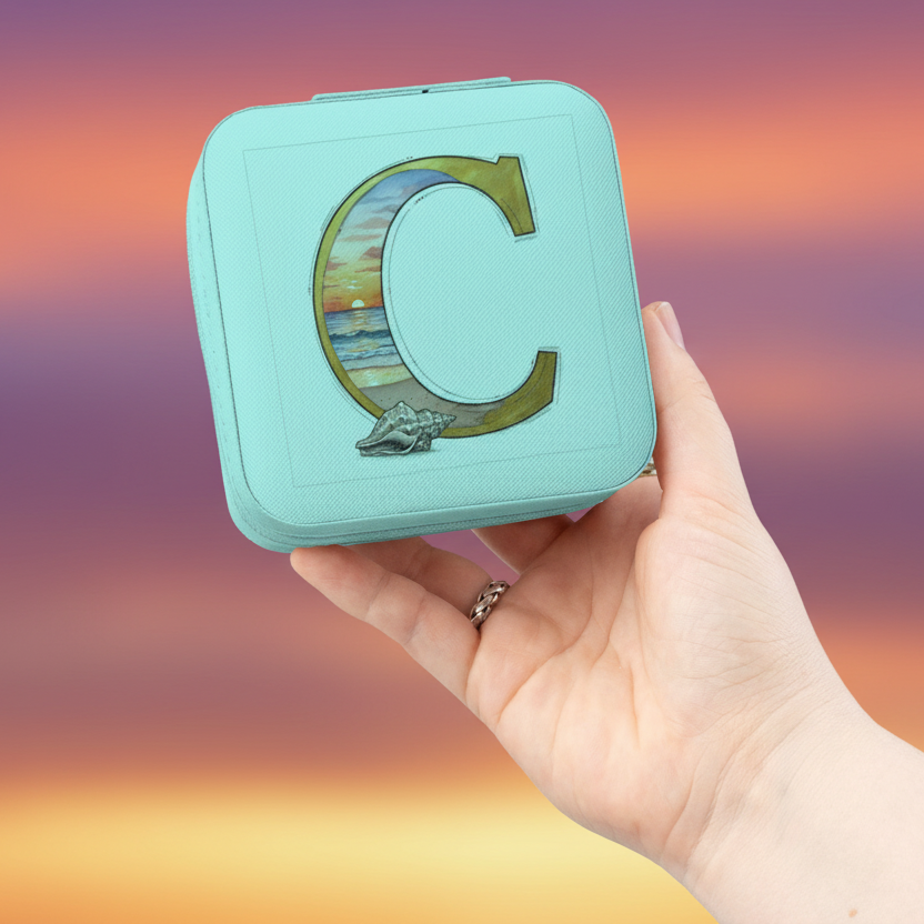 Hand holding a turquoise compact mirror with a letter 'C' design against a colorful gradient background