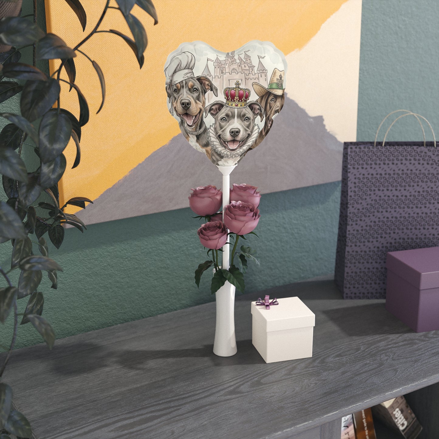 Decorative vase with cutout dog faces and flowers on a table against a colorful wall.