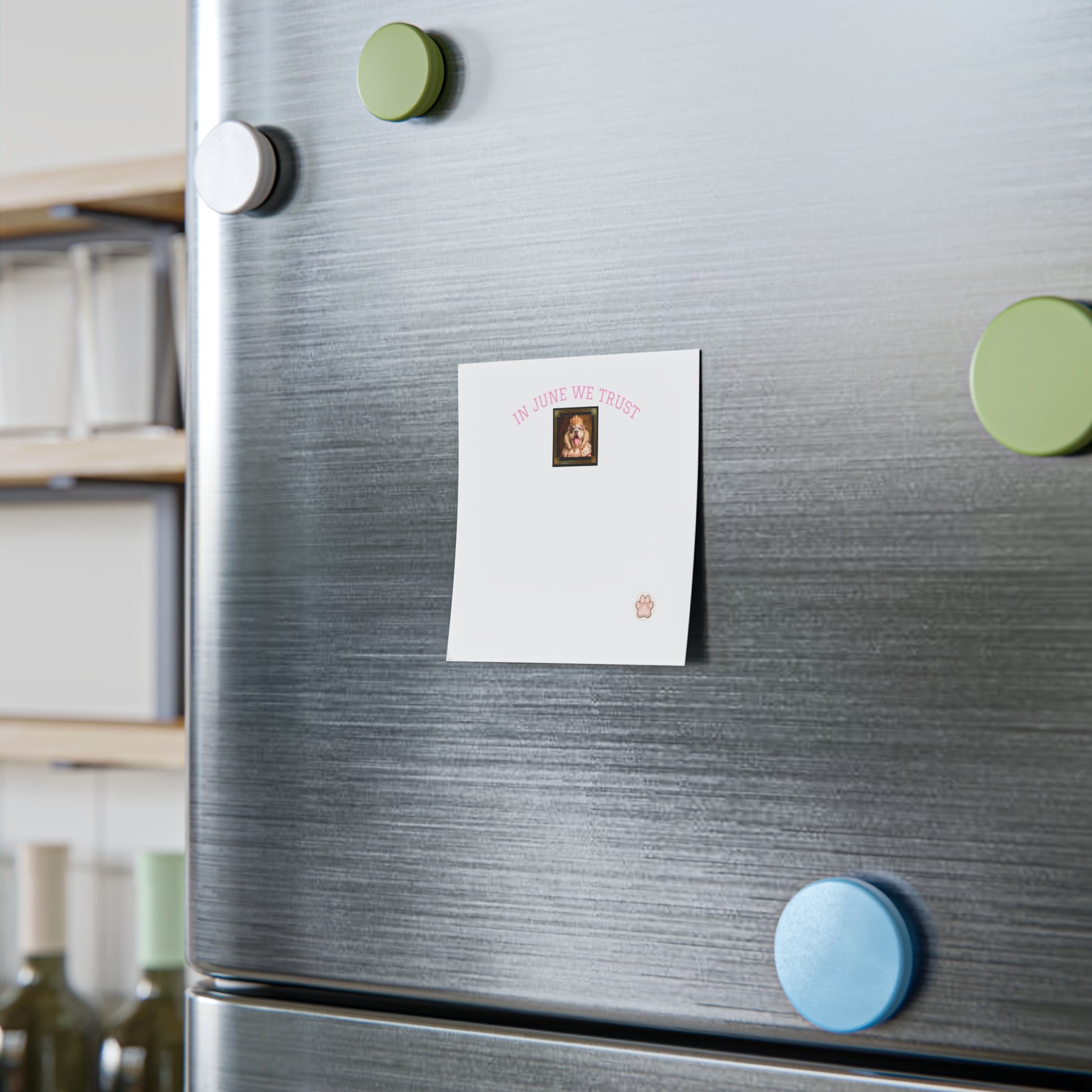Fridge with magnets and a note attached, kitchen setting with Queen June Post it note