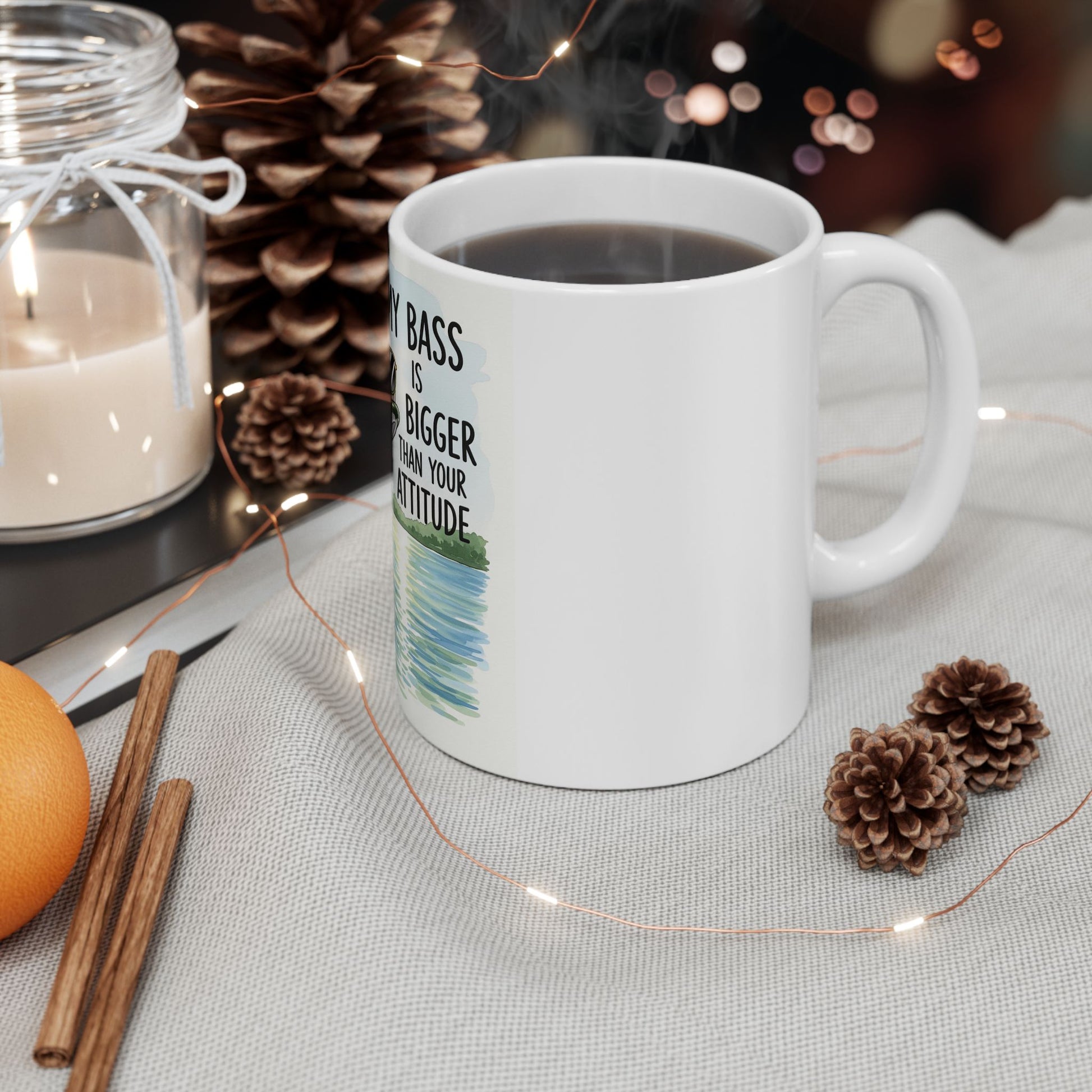 White mug with a printed design on a table with decorative items