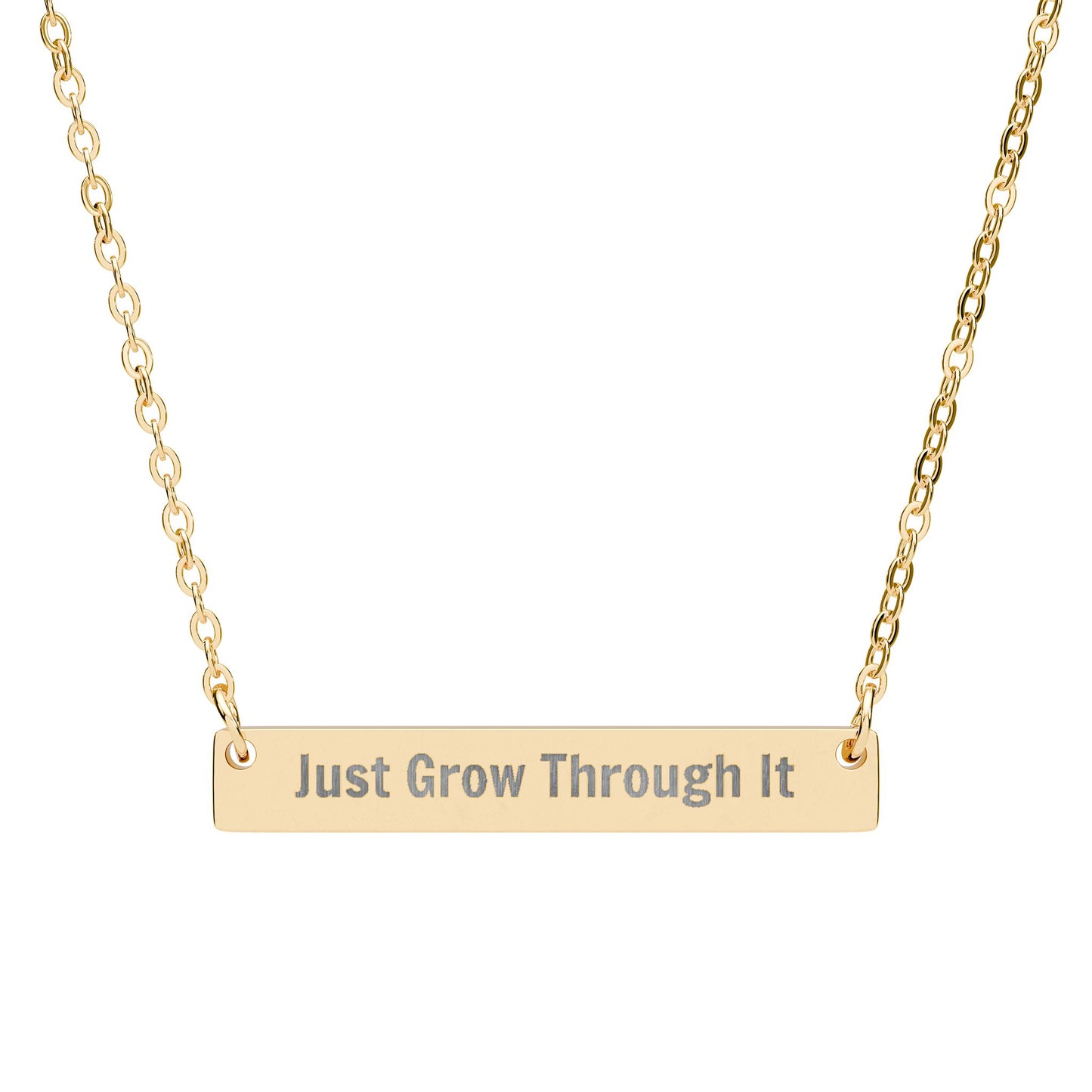 Gold necklace with 'Just Grow Through It' pendant on a white background