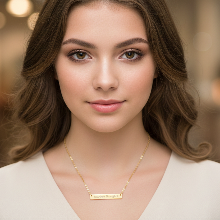 Love Grows Through It - Woman wearing a gold necklace against a blurred background