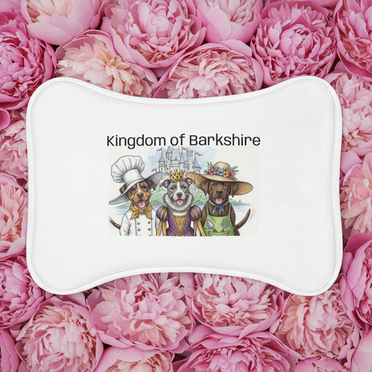 Pet feeding mat from the "Kingdom of Barkshire" on a background of pink peony flower blooms. 