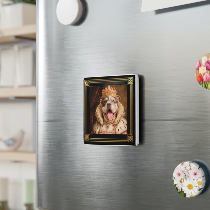 Fridge magnet with a dog wearing a crown on a metallic refrigerator.
