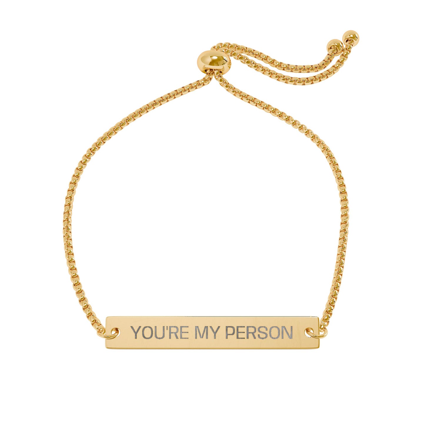 Gold bracelet with 'YOU'RE MY PERSON' engraving on a white background
