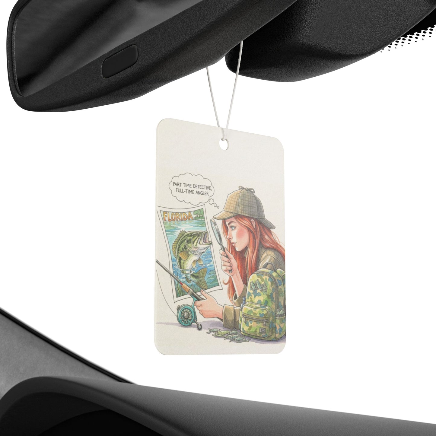 Car air freshener with illustration of a person holding a map and a fish, hanging from a car's rear view mirror.