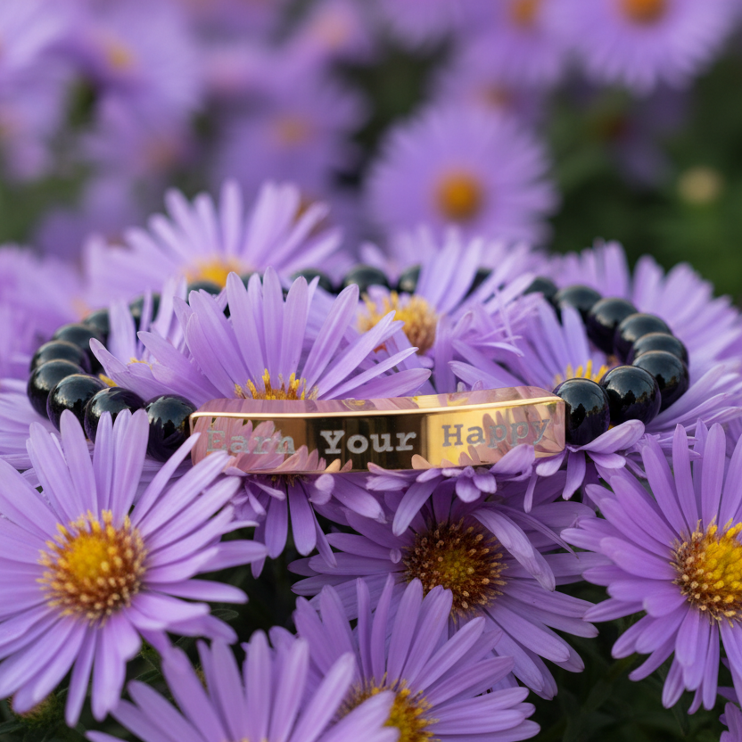 Earn Your Happy- Natural Stone Bracelet Bwith engraved text on purple flowers