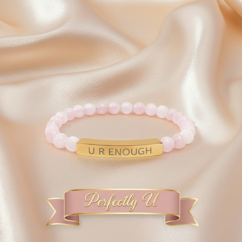 Pink natural stone beaded bracelet with gold tag on beige satin fabric, 'Perfectly U' brand visible.