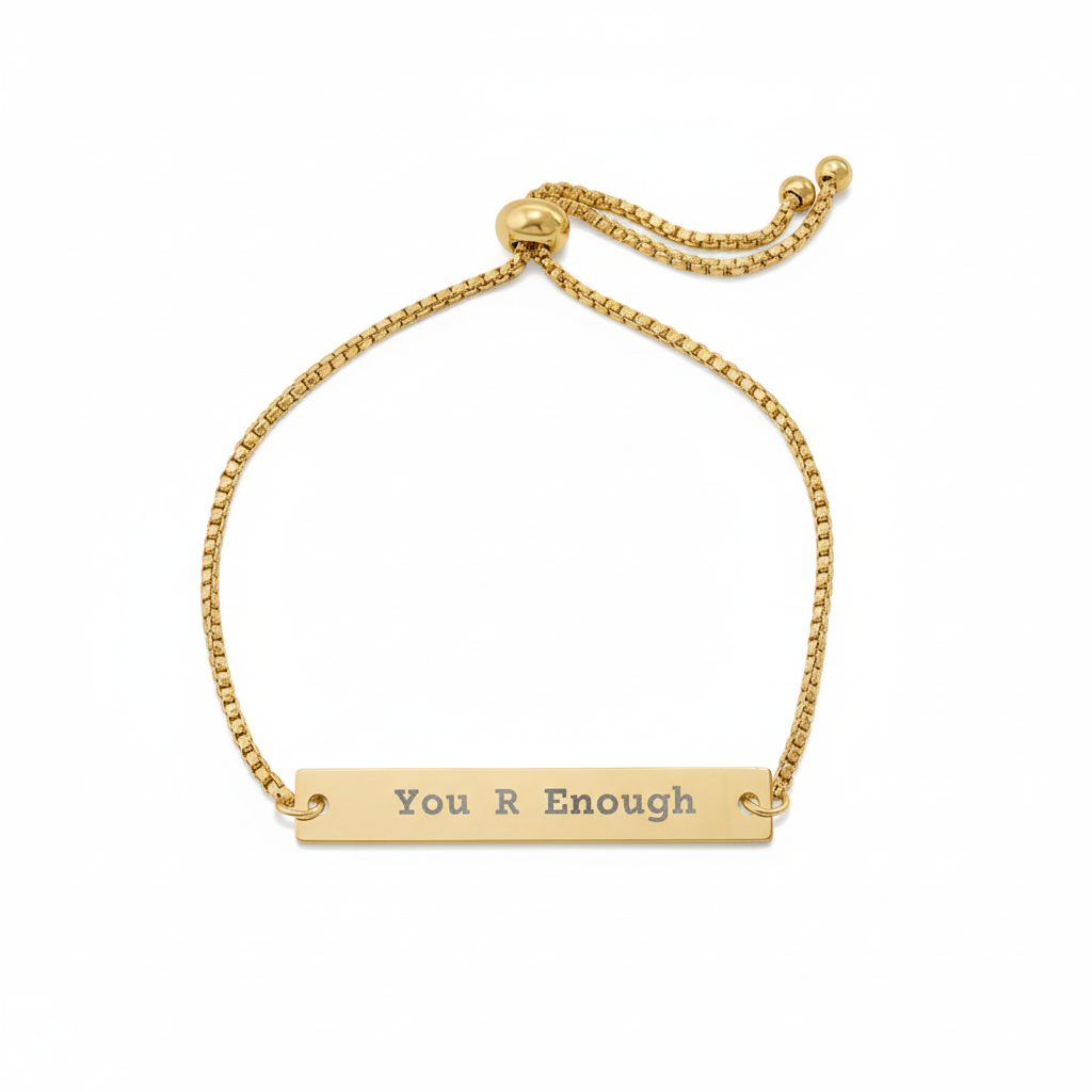 Gold bracelet with 'You R Enough' bar on a white background