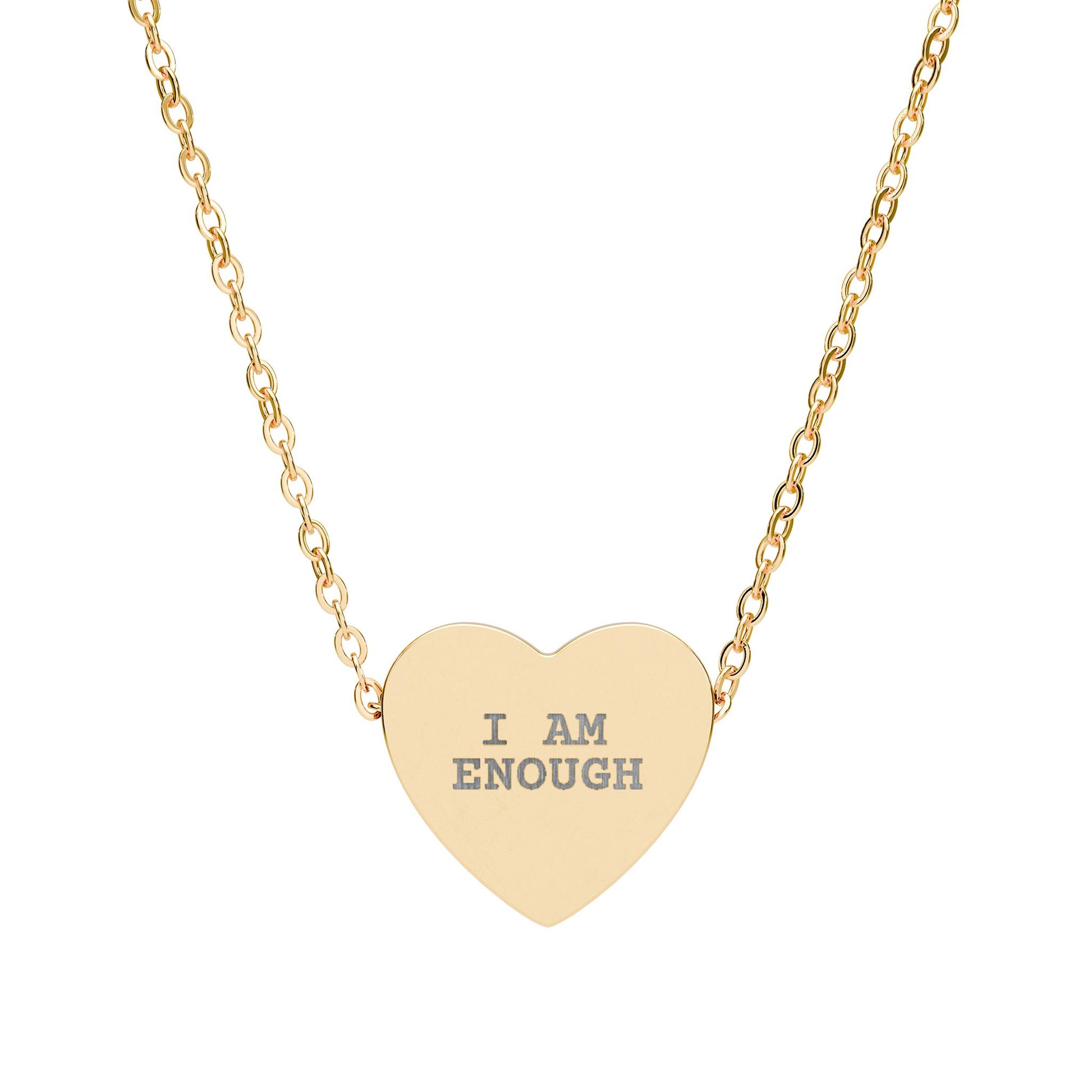 Gold heart-shaped necklace with 'I AM ENOUGH' engraving on a white background
