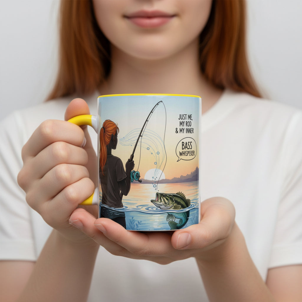Ceramic mug with a fishing-themed design featuring a person, rod, and fish, on a white background with a yellow interior and yellow handle.