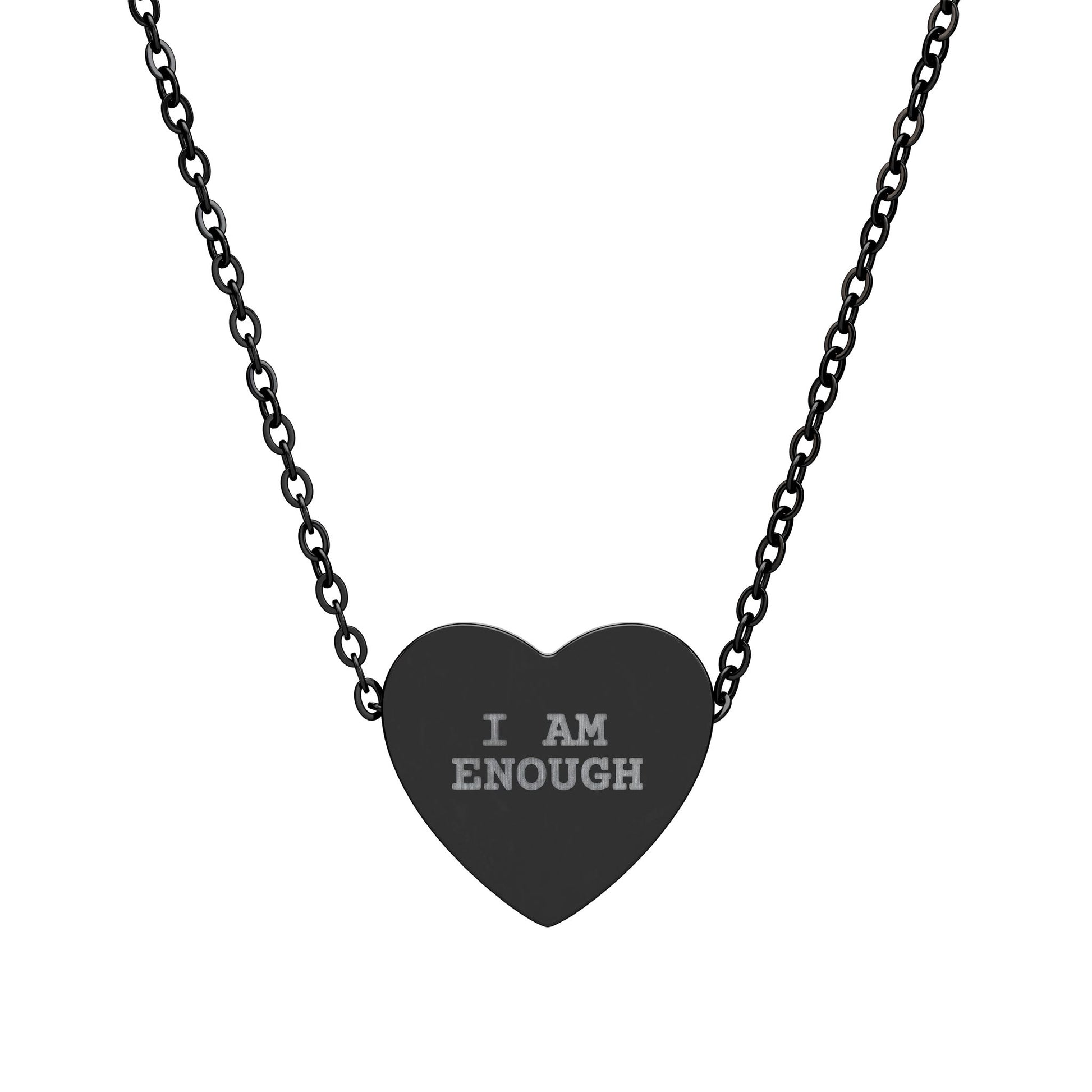 Heart-shaped pendant with 'I AM ENOUGH' engraving on a black chain against a white background