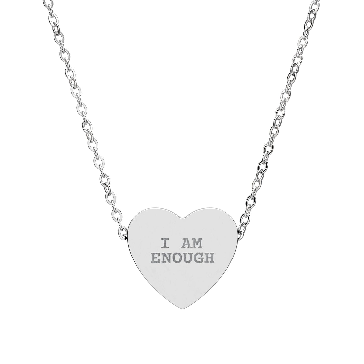 Silver heart-shaped pendant necklace with 'I AM ENOUGH' engraving on a white background