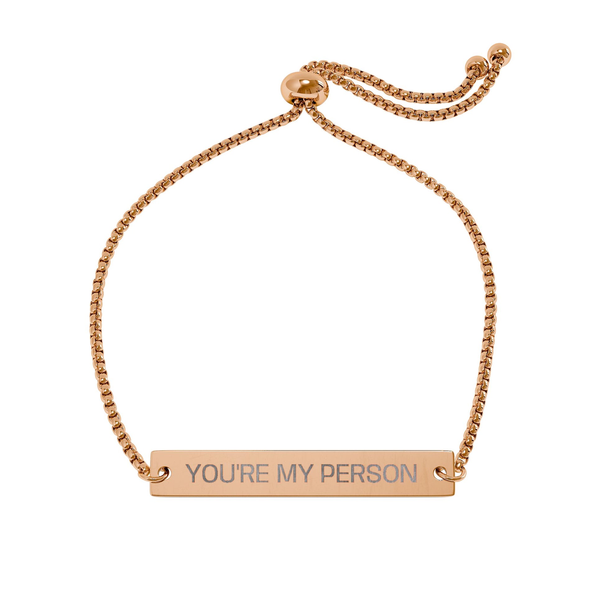 Rose gold bracelet with 'YOU'RE MY PERSON' engraving on a white background
