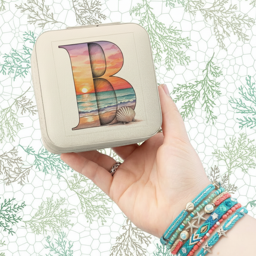 Hand holding a square pouch with a colorful 'B' design against a decorative background