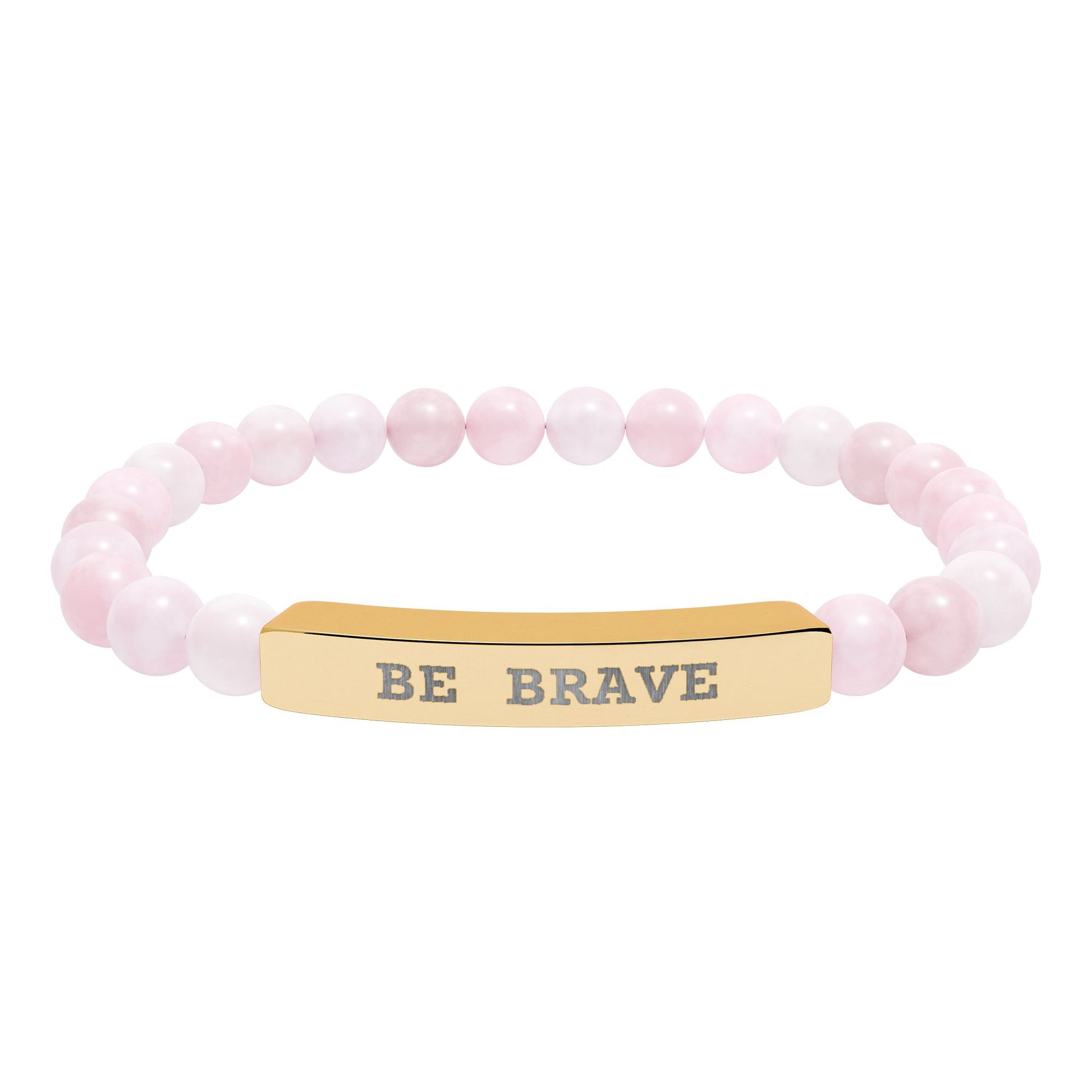Natural Stone beaded stretch bracelet with a gold bar message of Be Brave engraved on it, laying on a white  background