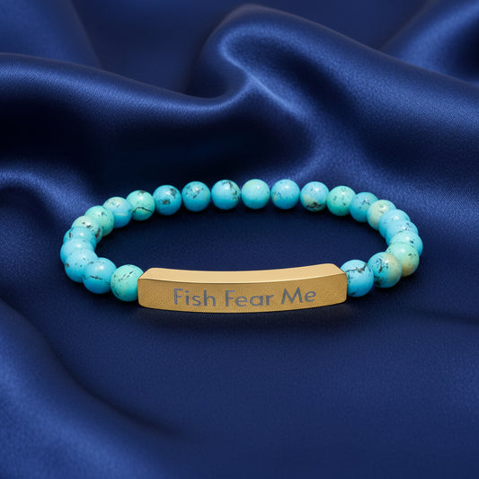 Turquoise natural stone stretch beaded bracelet with gold  'Fish Fear Me' on a white background