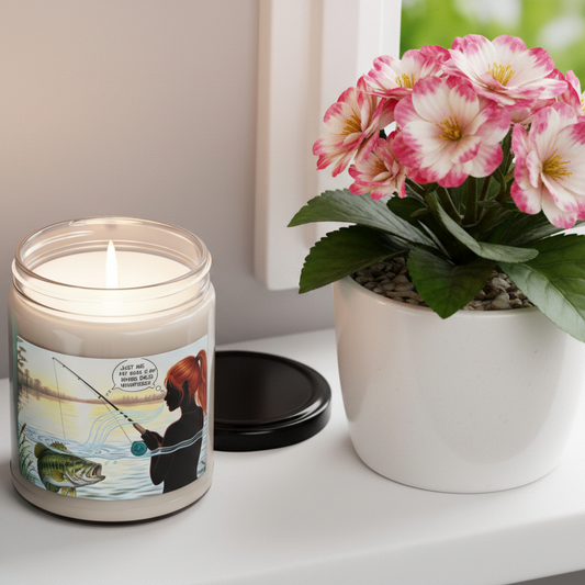Apple Harvest 9 oz Bass Whisperer candle  - Candle with a fishing design and a potted Bebonia plant on a surface