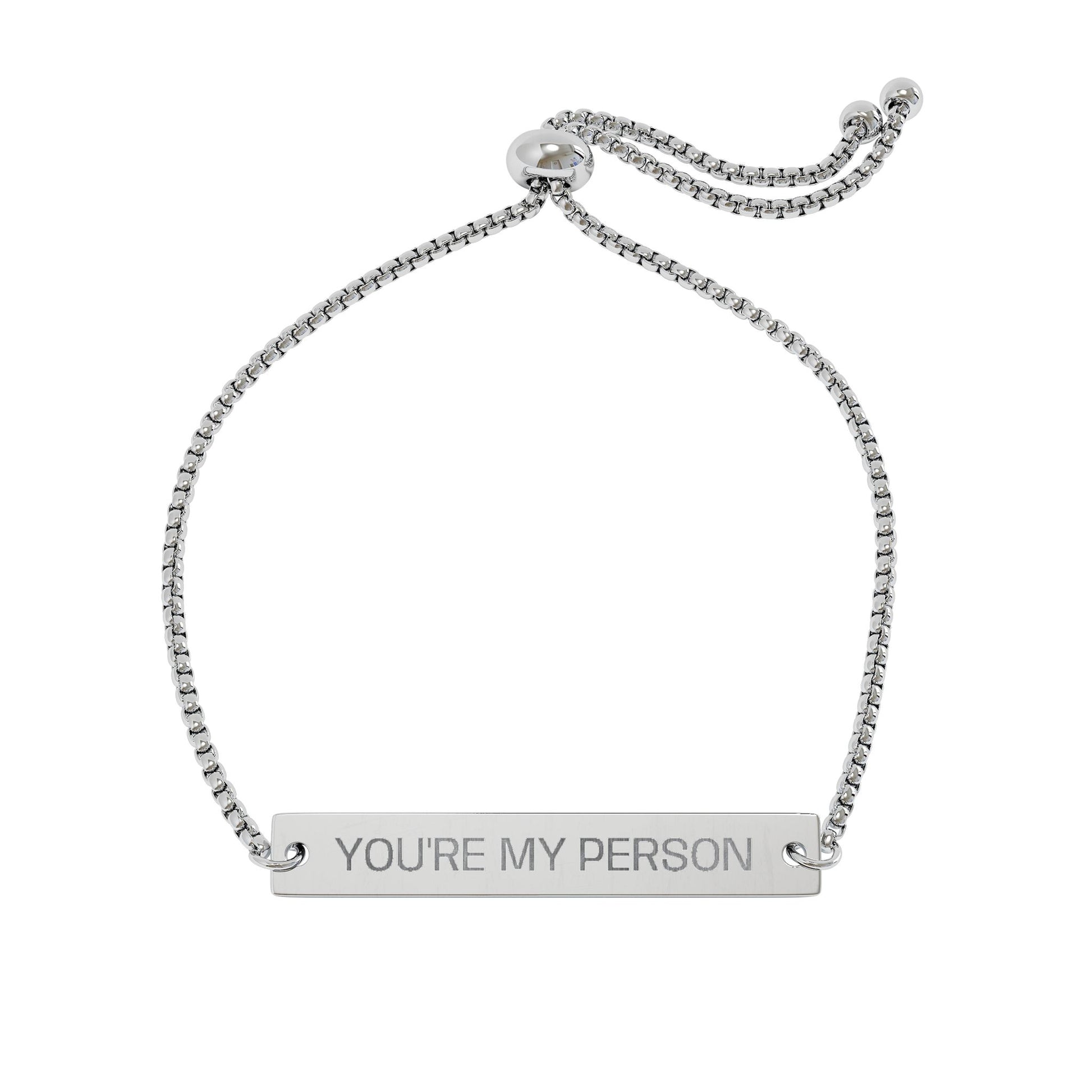 Silver bracelet with 'YOU'RE MY PERSON' engraving on a white background

