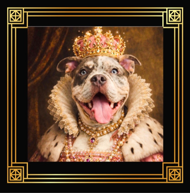 A regal, close-up portrait of a merle-colored dog with striking blue eyes, known as Queen June. She is dressed in lavish royal attire, featuring a high, ornate lace ruff collar and a pink gown adorned with pearls and jewels. She wears a magnificent gold crown encrusted with pink gems and pearls, and multiple strands of pearl necklaces with a large purple gemstone pendant. The portrait is set within an elegant black and gold geometric frame against a warm, textured background.